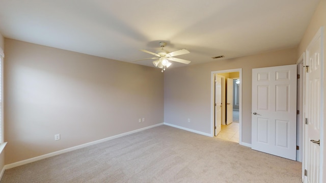 135 Coach Ln, Augusta, GA 30907 - unfurnished bedroom featuring ceiling fan, visible vents, baseboards, and light carpet