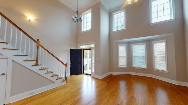 135 Coach Ln, Augusta, GA 30907 - entrance foyer featuring stairway, baseboards, a towering ceiling, and wood finished floors