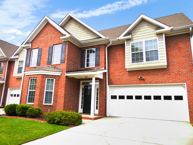 135 Coach Ln, Augusta, GA 30907 - view of front of home with concrete driveway, an attached garage, and brick siding