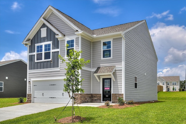 909 Kay Pl, Grovetown, GA 30813 - craftsman inspired home featuring board and batten siding, a garage, concrete driveway, a front yard, and stone siding