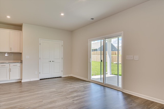 909 Kay Pl, Grovetown, GA 30813 - unfurnished dining area featuring light wood-type flooring and recessed lighting