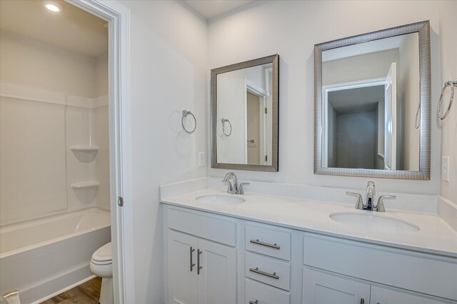 909 Kay Pl, Grovetown, GA 30813 - bathroom featuring double vanity, tub / shower combination, and wood finished floors