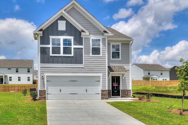 909 Kay Pl, Grovetown, GA 30813 - craftsman-style home featuring board and batten siding, driveway, an attached garage, and stone siding