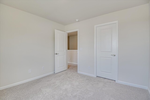 909 Kay Pl, Grovetown, GA 30813 - unfurnished bedroom with light colored carpet and baseboards
