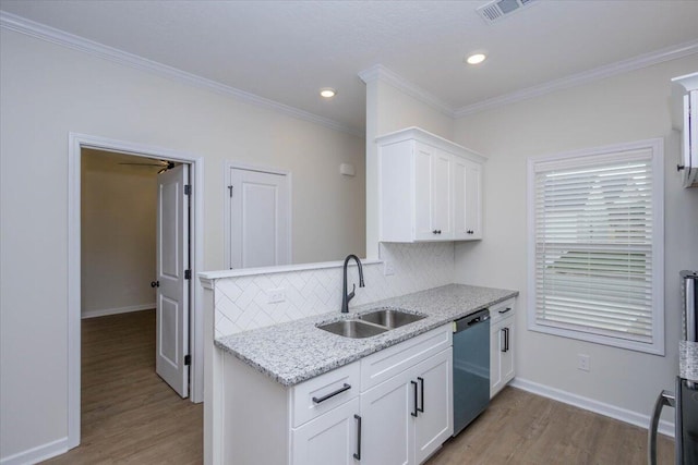 kitchen featuring stainless steel dishwasher, sink, light hardwood / wood-style flooring, and white cabinets