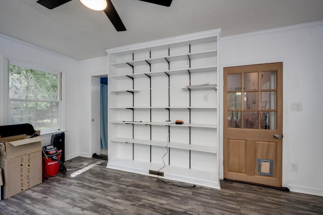 office featuring ceiling fan, dark wood finished floors, ornamental molding, and visible vents