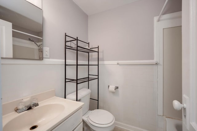bathroom featuring vanity, shower / bathing tub combination, and toilet