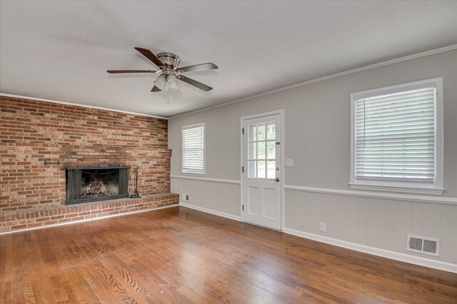 986 Campbellton Dr, North Augusta, SC 29841 - unfurnished living room featuring wood finished floors, a ceiling fan, ornamental molding, a fireplace, and wainscoting