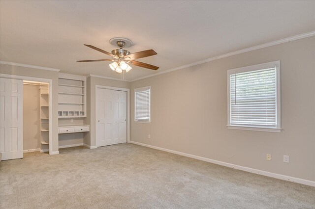 986 Campbellton Dr, North Augusta, SC 29841 - unfurnished bedroom with two closets, carpet, ornamental molding, and a ceiling fan
