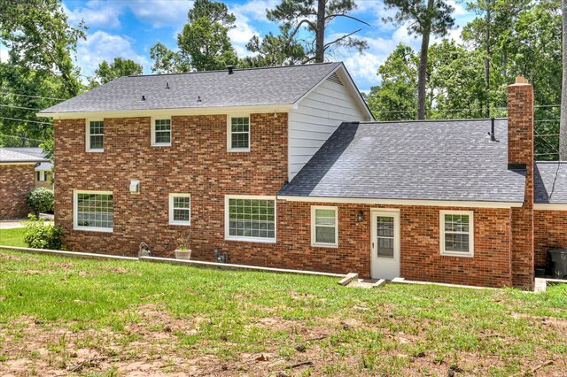 986 Campbellton Dr, North Augusta, SC 29841 - rear view of house featuring a lawn, a chimney, roof with shingles, and brick siding