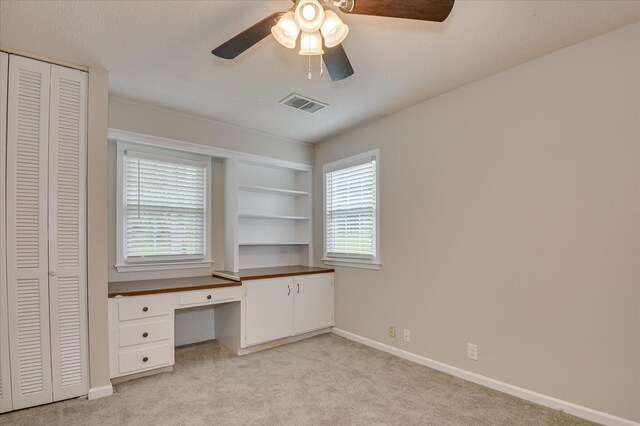 986 Campbellton Dr, North Augusta, SC 29841 - unfurnished office featuring ceiling fan, light carpet, built in desk, and built in features