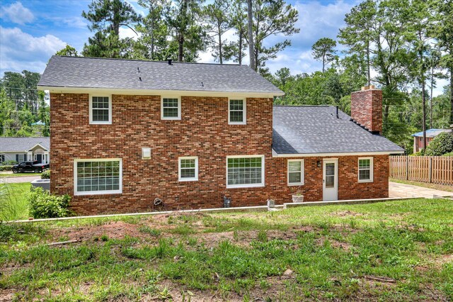 986 Campbellton Dr, North Augusta, SC 29841 - view of front of home featuring roof with shingles, a chimney, brick siding, and a patio area