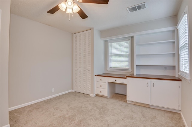 986 Campbellton Dr, North Augusta, SC 29841 - unfurnished office with light carpet, a ceiling fan, built in desk, and plenty of natural light