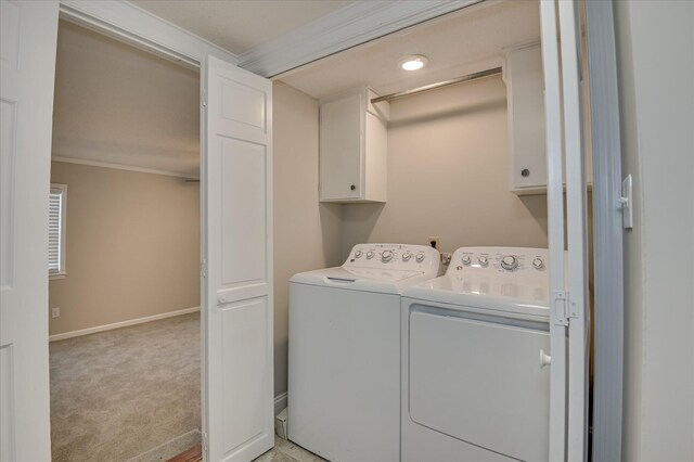 986 Campbellton Dr, North Augusta, SC 29841 - laundry area featuring cabinet space, separate washer and dryer, ornamental molding, and light colored carpet