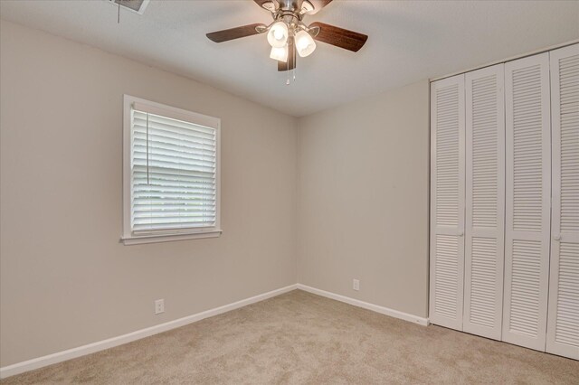 986 Campbellton Dr, North Augusta, SC 29841 - unfurnished bedroom with a closet, light colored carpet, and a ceiling fan