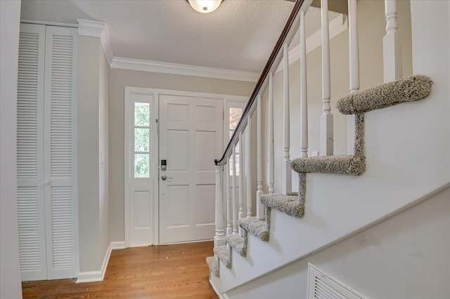 986 Campbellton Dr, North Augusta, SC 29841 - foyer with stairway, crown molding, light wood-style floors, and a textured ceiling
