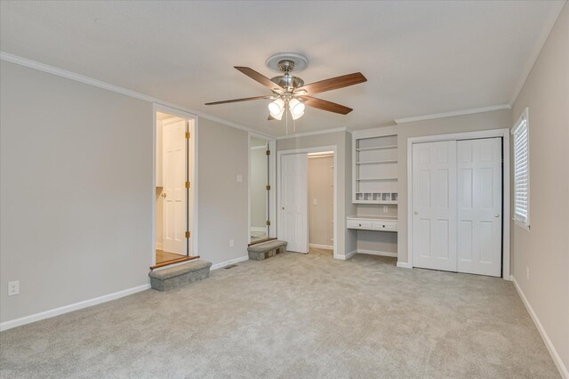 986 Campbellton Dr, North Augusta, SC 29841 - unfurnished bedroom featuring two closets, carpet flooring, ornamental molding, a ceiling fan, and ensuite bathroom