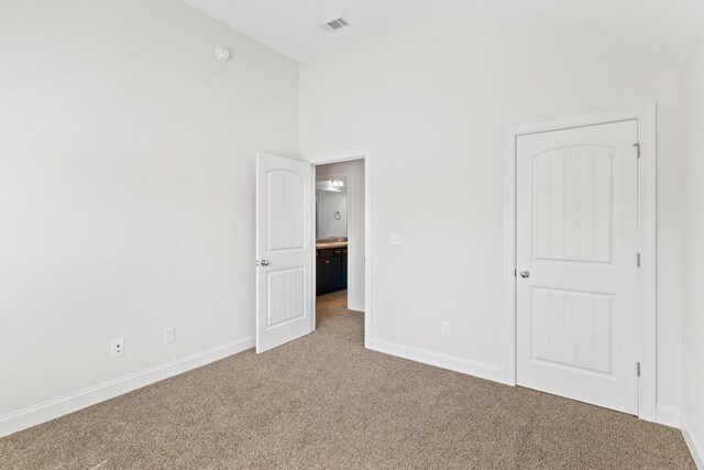 207 Hazelwood Ct, Grovetown, GA 30813 - unfurnished bedroom featuring carpet flooring, baseboards, and high vaulted ceiling