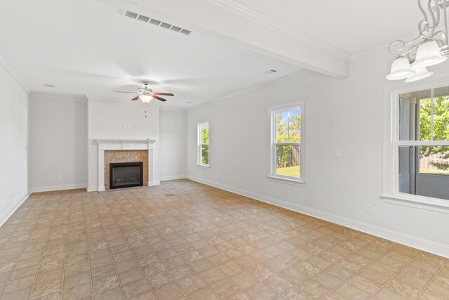 207 Hazelwood Ct, Grovetown, GA 30813 - unfurnished living room featuring baseboards, ceiling fan, a chandelier, ornamental molding, and a tiled fireplace