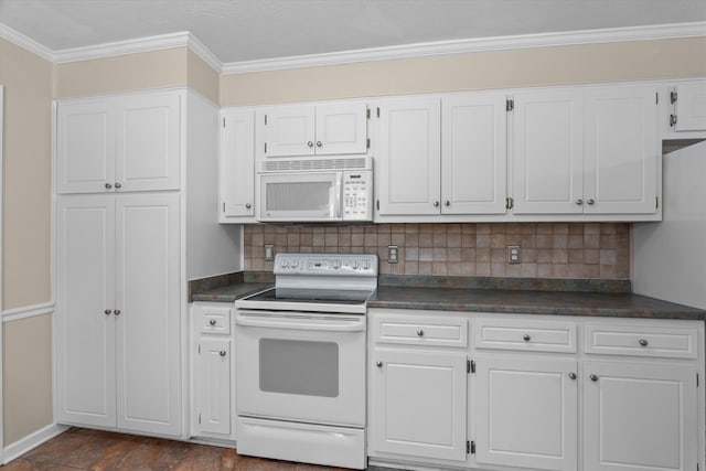 kitchen with white appliances, white cabinets, and dark countertops