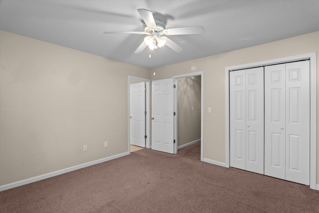 unfurnished bedroom with a closet, baseboards, carpet, and ceiling fan