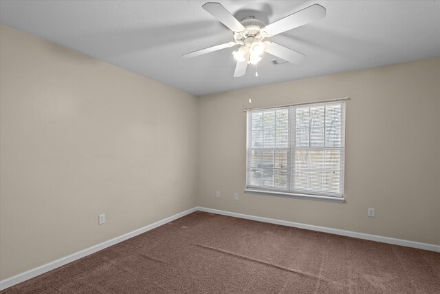 unfurnished room featuring carpet, baseboards, and ceiling fan