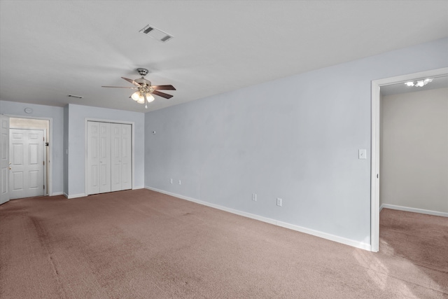 unfurnished bedroom with visible vents, baseboards, and carpet