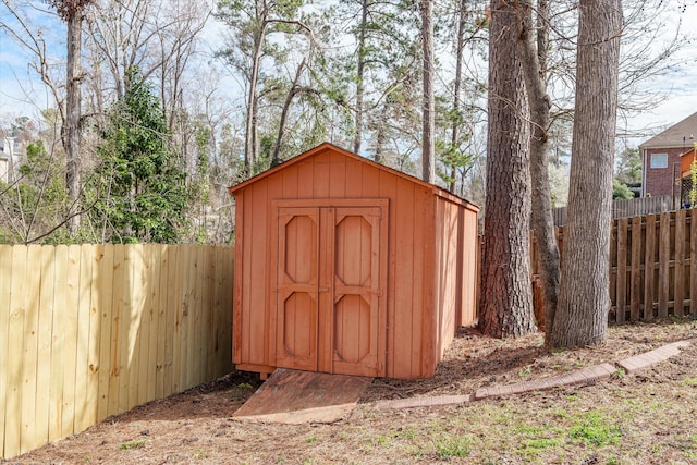 view of shed with a fenced backyard