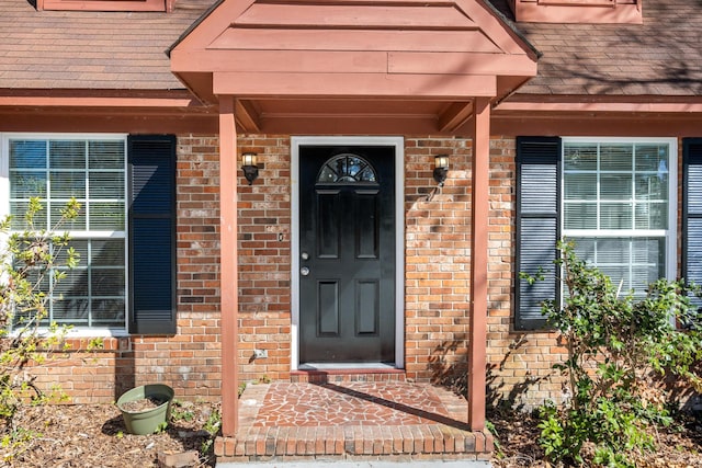 entrance to property with brick siding