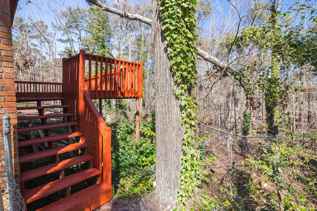 view of yard with stairway and a wooden deck