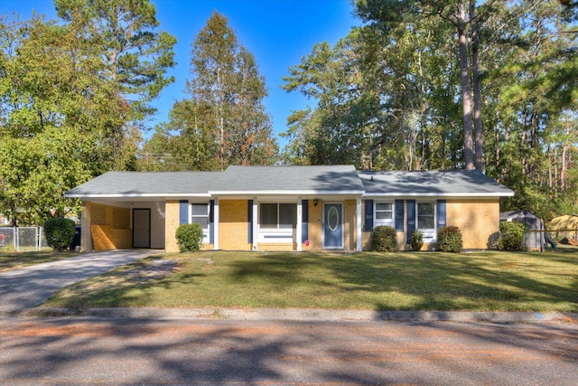 ranch-style house with a front yard and a carport