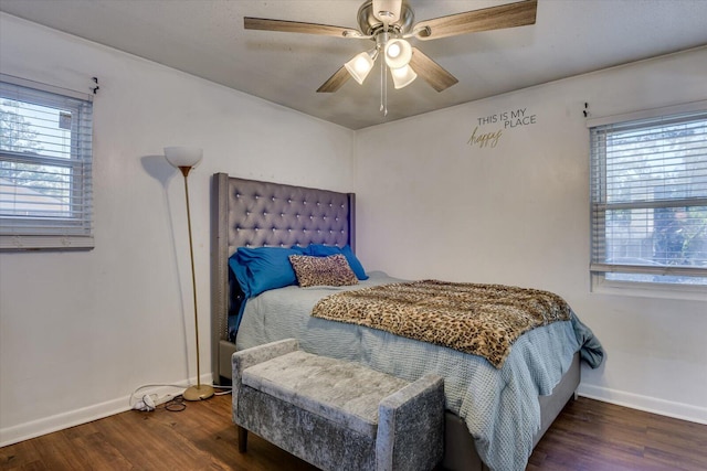 bedroom with ceiling fan and dark hardwood / wood-style flooring