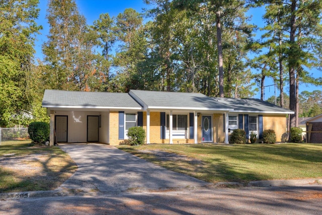 ranch-style house with a carport and a front yard