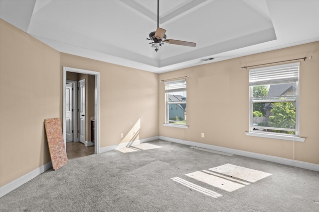 220 Dripping Rock Pass, Grovetown, GA 30813 - empty room featuring a tray ceiling, carpet flooring, and a ceiling fan