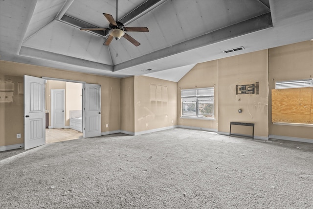 220 Dripping Rock Pass, Grovetown, GA 30813 - unfurnished living room with carpet floors, ceiling fan, vaulted ceiling, and a tray ceiling