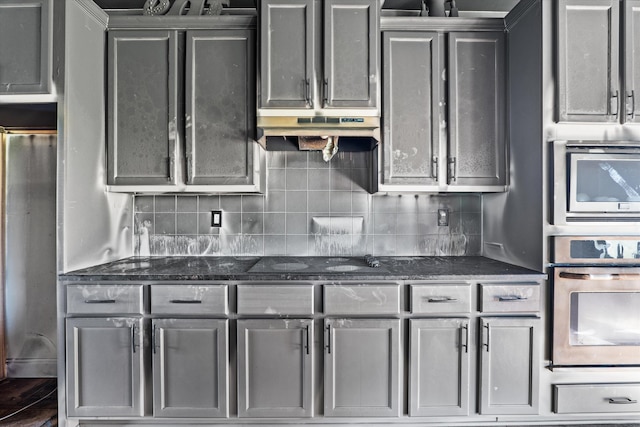 220 Dripping Rock Pass, Grovetown, GA 30813 - kitchen featuring stainless steel appliances, gray cabinetry, under cabinet range hood, and backsplash