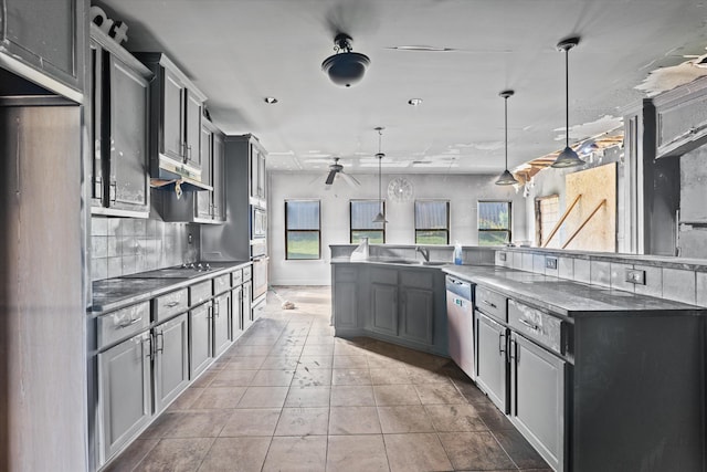 220 Dripping Rock Pass, Grovetown, GA 30813 - kitchen with appliances with stainless steel finishes, backsplash, a ceiling fan, hanging light fixtures, and tile patterned flooring