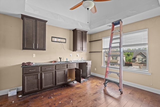 220 Dripping Rock Pass, Grovetown, GA 30813 - kitchen with dark brown cabinets, a tray ceiling, a ceiling fan, and dark wood finished floors
