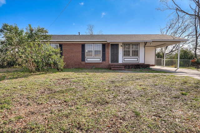 ranch-style house with a carport and a front lawn