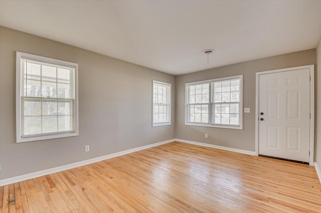 foyer entrance with light hardwood / wood-style floors