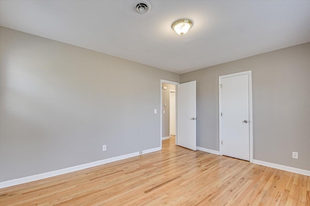 unfurnished bedroom featuring light wood-type flooring