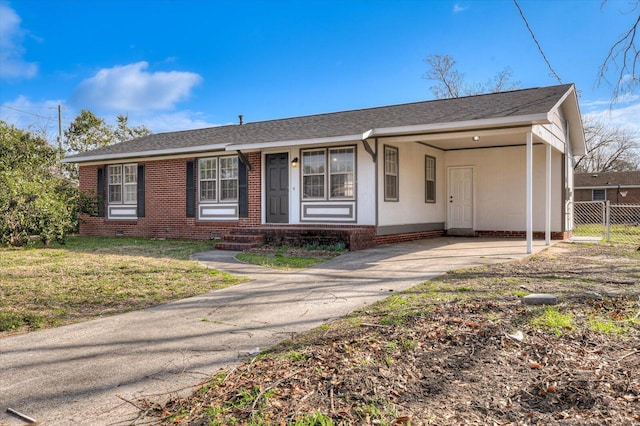 ranch-style home featuring a front yard and a carport