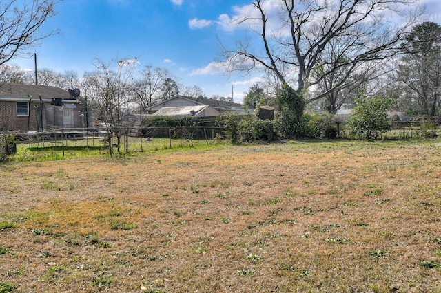 view of yard with a trampoline