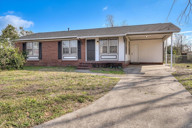 ranch-style house featuring a front lawn and a carport