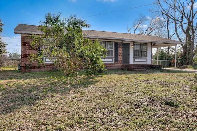 ranch-style home with a front yard