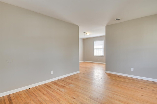 empty room with light wood-type flooring