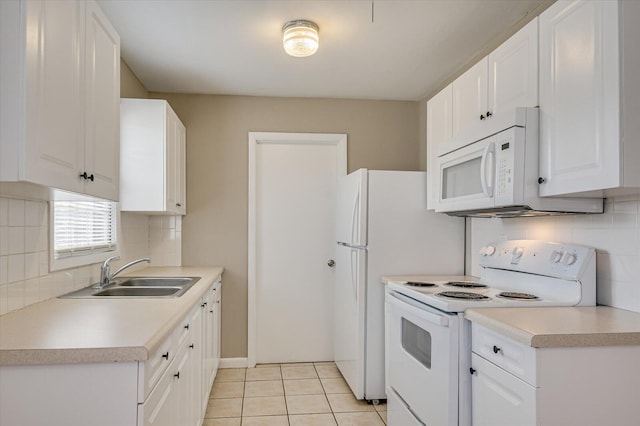 kitchen featuring sink, white appliances, and white cabinets