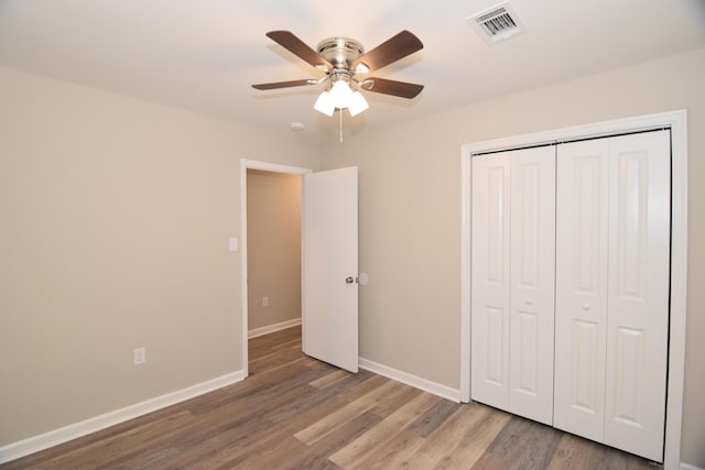3516 Gardenbrook Dr, Augusta, GA 30906 - unfurnished bedroom with baseboards, wood finished floors, a closet, and ceiling fan