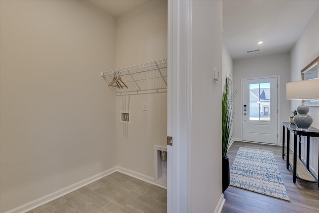 laundry area with recessed lighting, visible vents, and baseboards