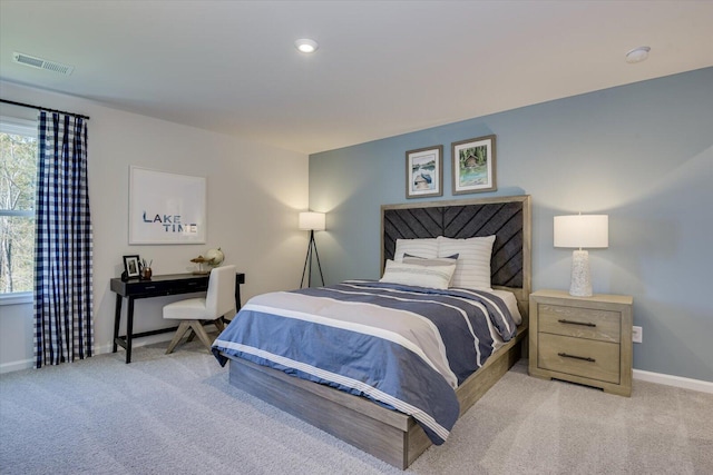 bedroom with recessed lighting, light colored carpet, visible vents, and baseboards